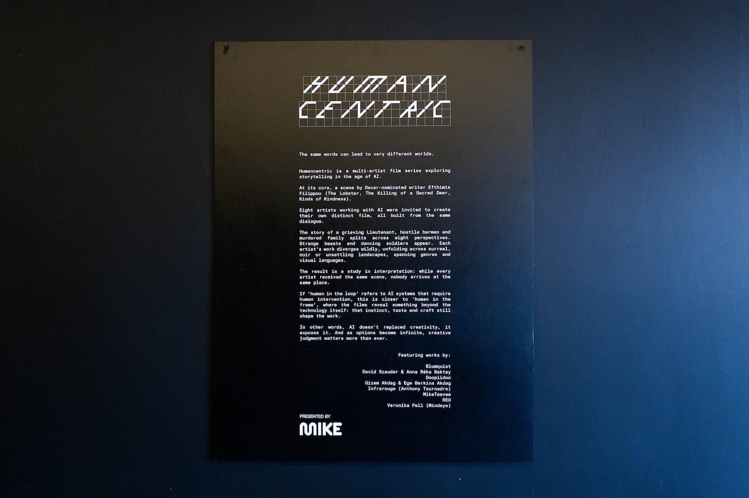 The wall text explaining the experiment, presented by MikeTeevee
